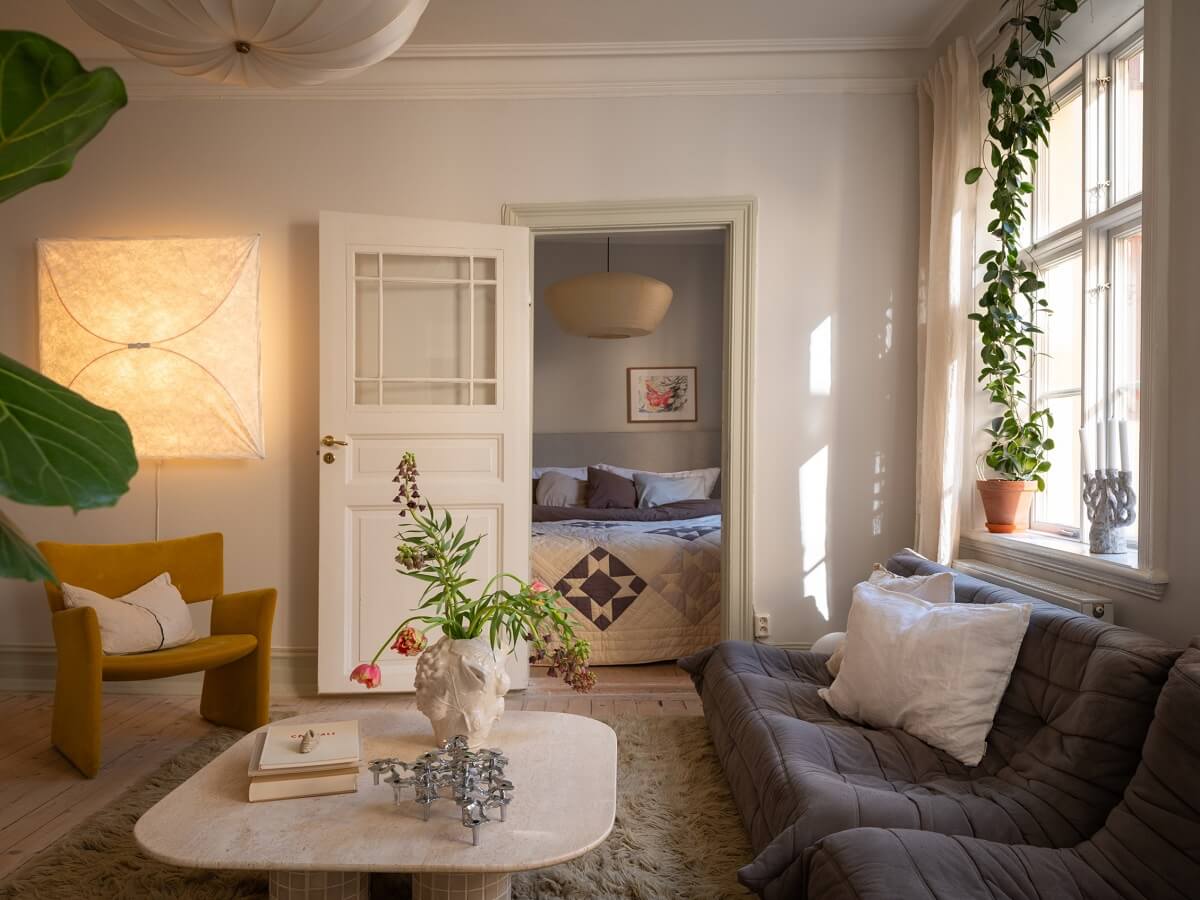Light Rooms and Soft Color Tones in a Swedish Apartment 7 natural light in living room with ligne roset sofa