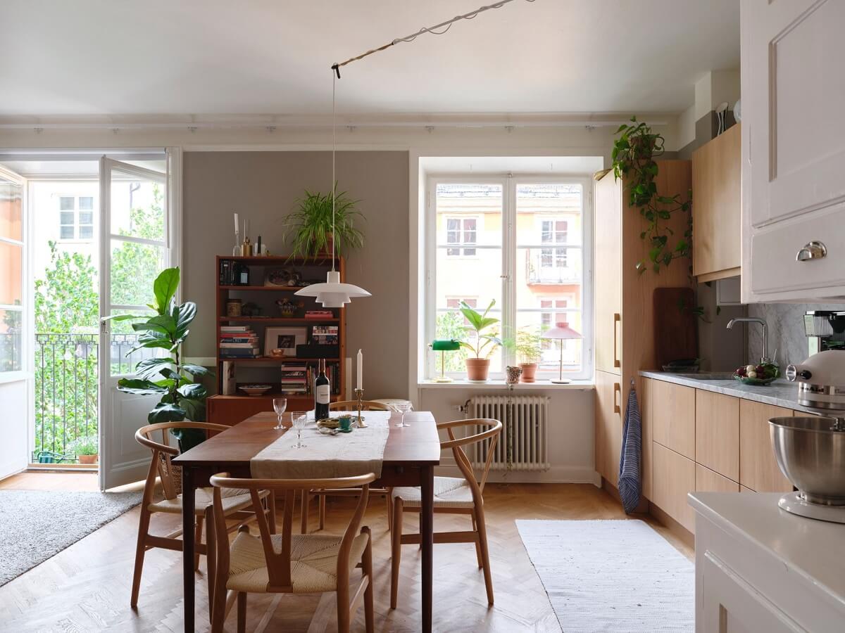 A Small Gray Apartment with Industrial Glass Walls 8 oak kitchen with wooden dining table