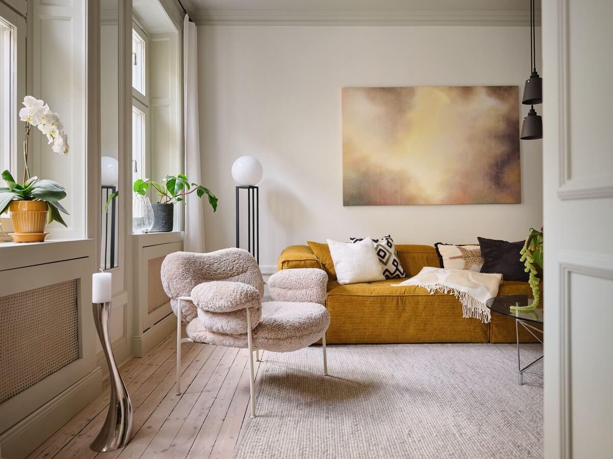 A Light Filled Duplex Apartment in Sweden 11 ochre yellow sofa in light living room