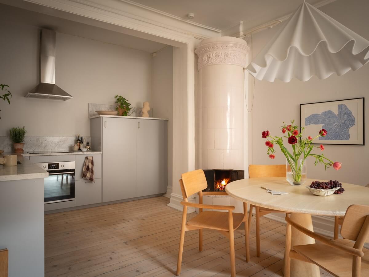 Light Rooms and Soft Color Tones in a Swedish Apartment 11 open plan kitchen and dining room with wooden floor
