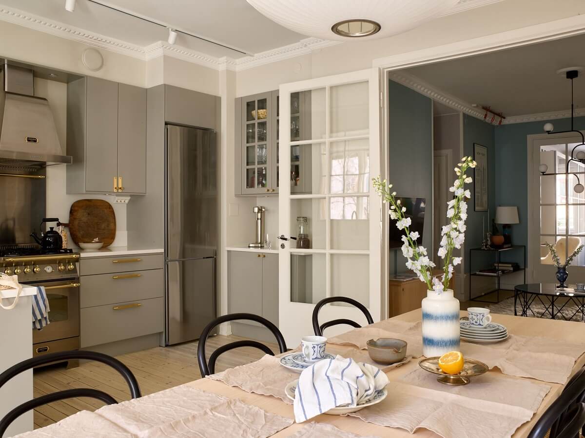 A Social Scandinavian Apartment with a Light Blue Living Room 2 open plan kitchen and dining room
