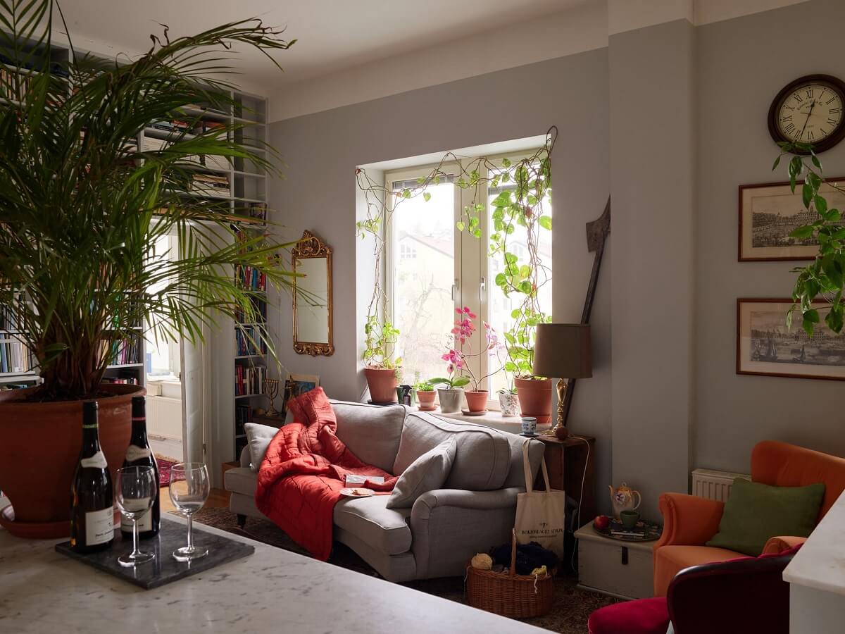 Floor-to-Ceiling Bookcases in a 1950s Swedish Home 5 open plan kitchen living room