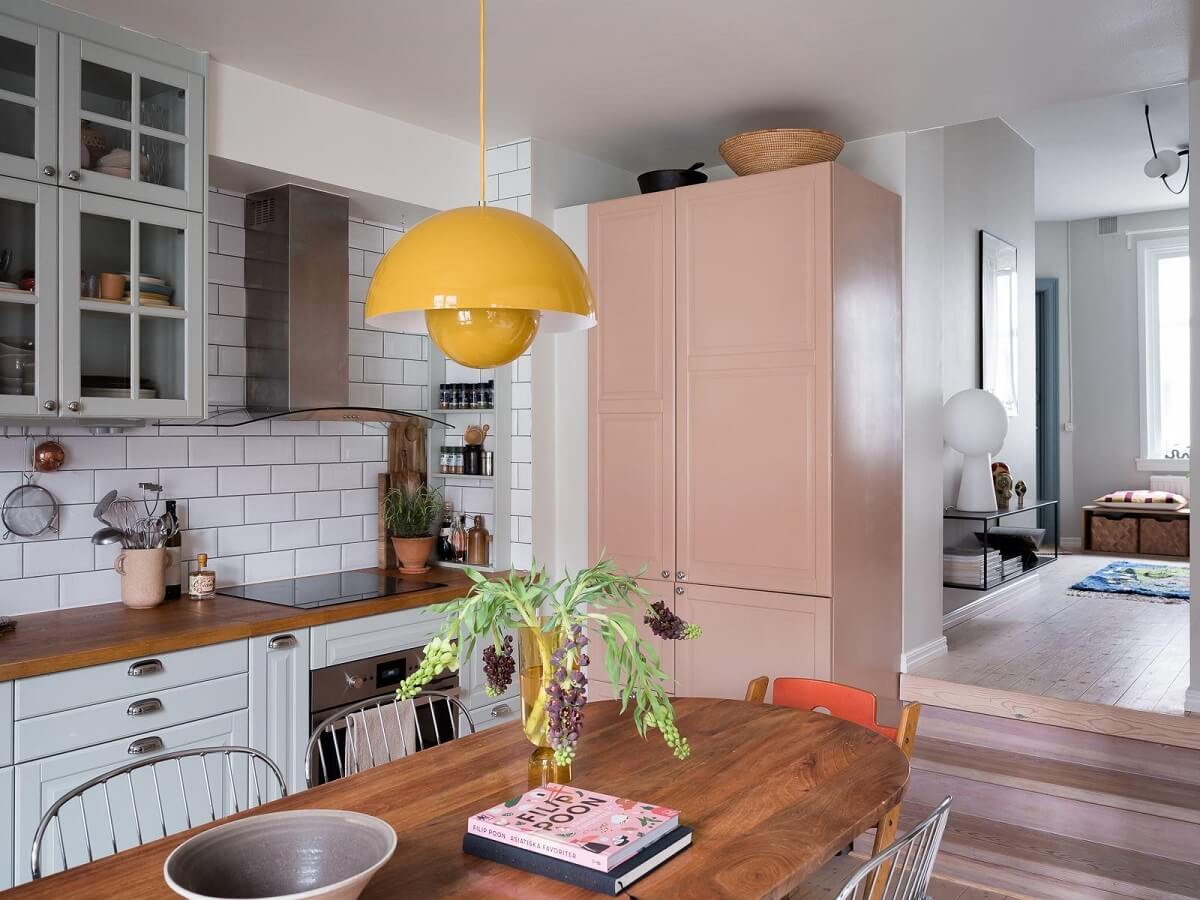 A Beautiful Color Palette in a Scandinavian Family Apartment 7 pastel pink fridge cabinets
