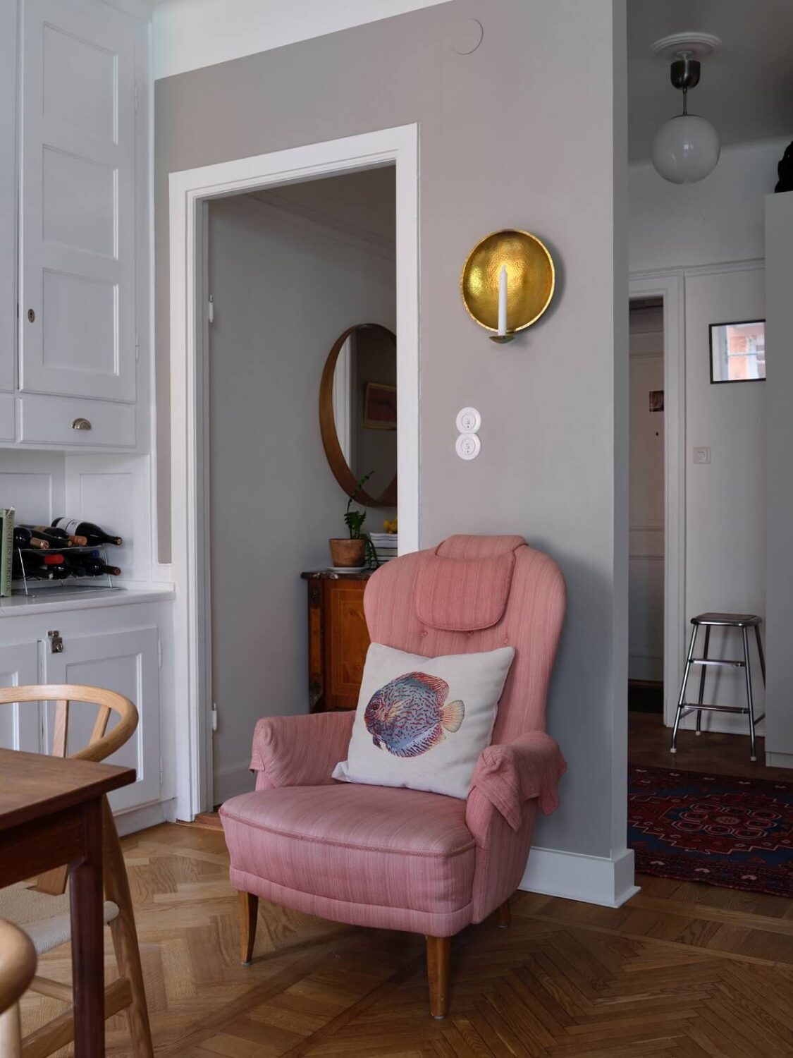 A Small Gray Apartment with Industrial Glass Walls 13 pink armchair