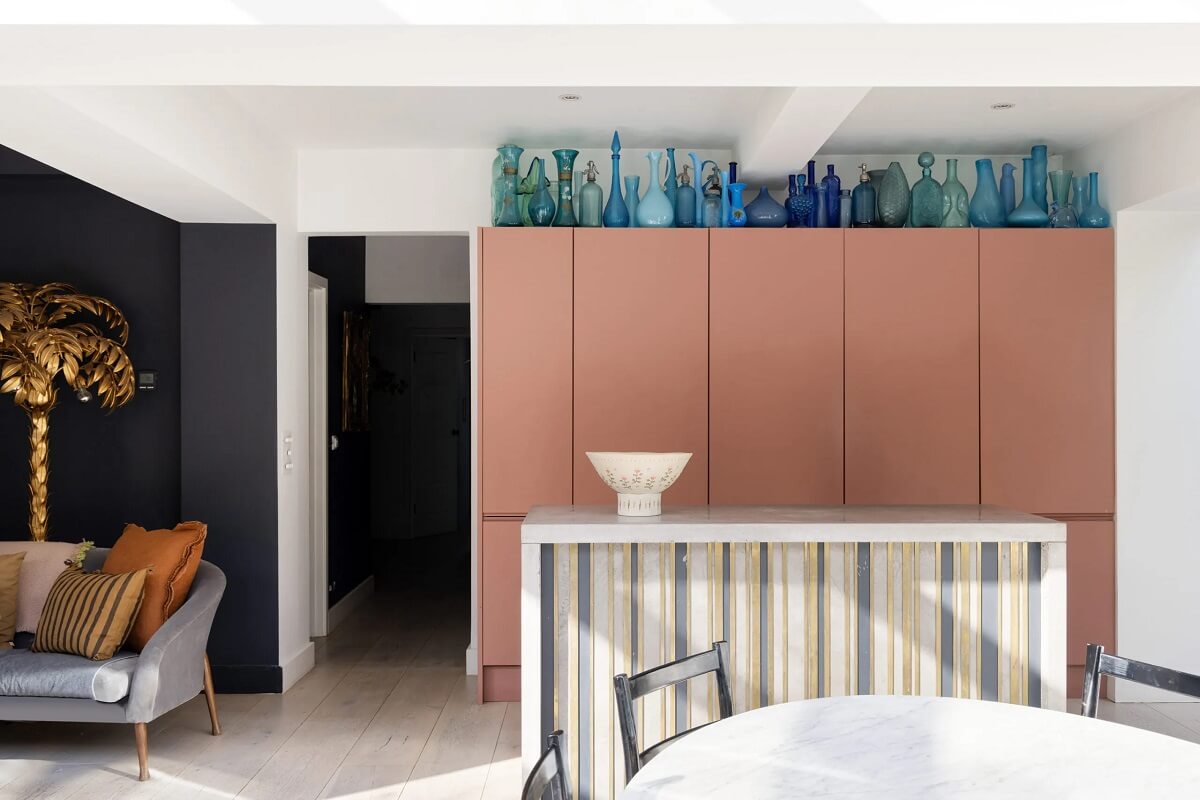 A Modern Apartment with Skylights in a Historic Building 6 pink kitchen cabinets