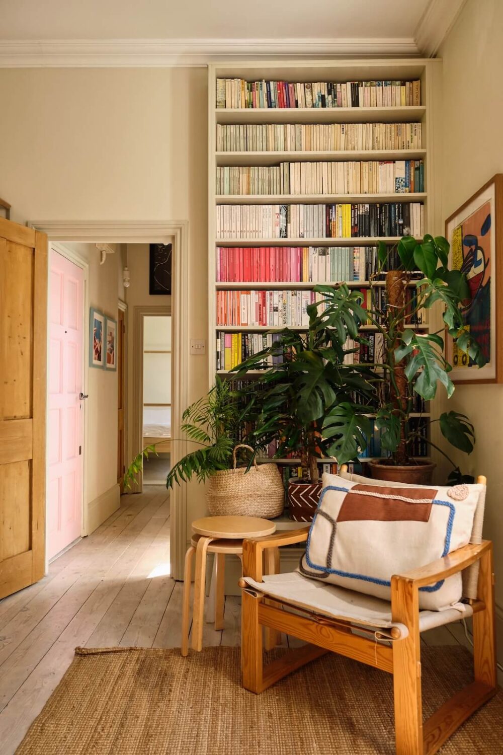 A Light London Apartment with a Yellow Kitchen 5 reading nook with floor to ceiling bookcase