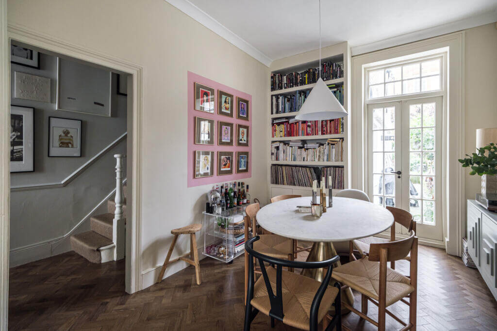 A London House Decorated in Gray and Beige Tones 7 round dining table and bookshelves