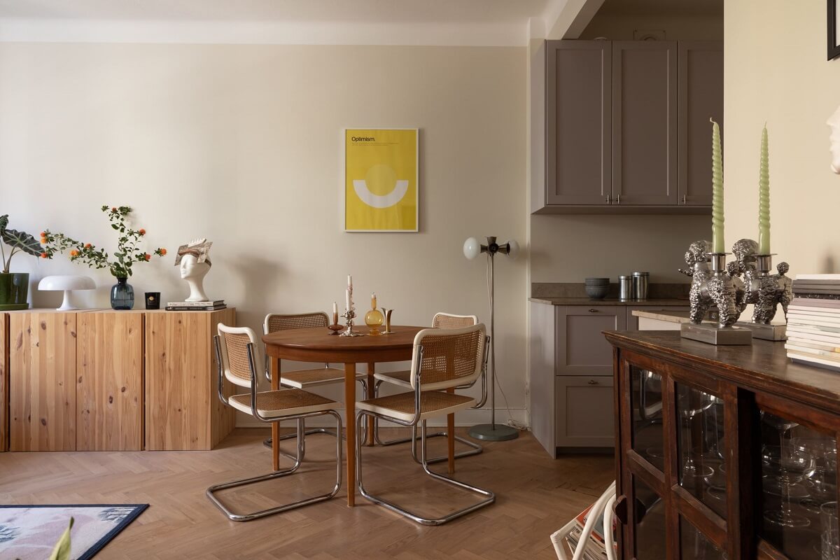 A Renovated Swedish Apartment with a Pink Bathroom 4 round wooden dining table