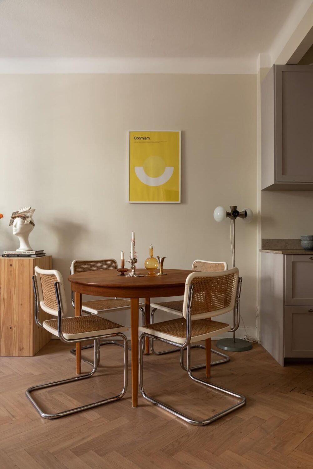 A Renovated Swedish Apartment with a Pink Bathroom 6 round wooden dining table in open plan living space