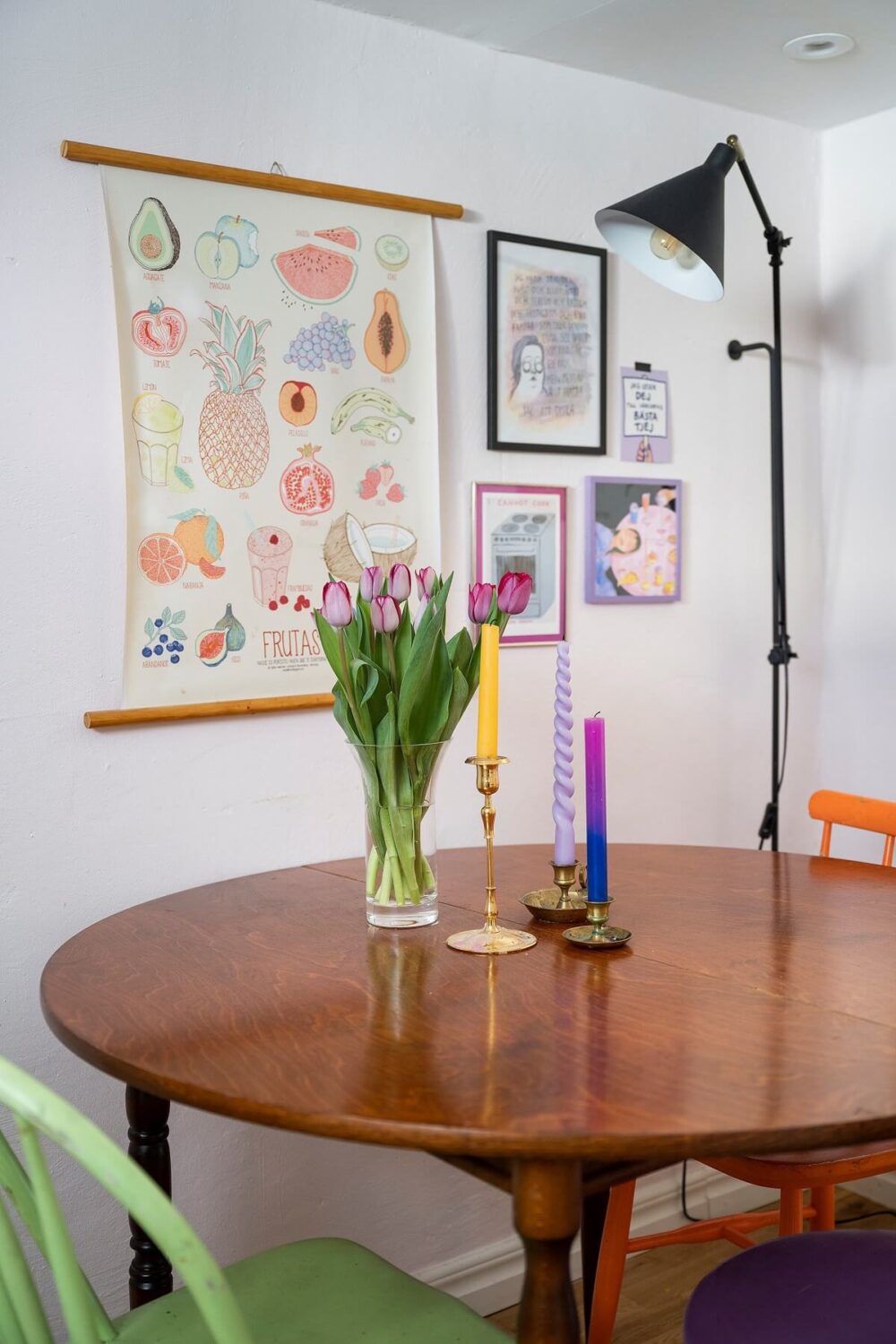 A Basement Family Apartment with Colorful Furniture and Decor 11 round wooden dining table with colorful chairs