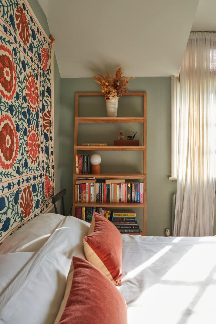 A Small Cottage-Style Apartment in London 17 sage green bedroom walls