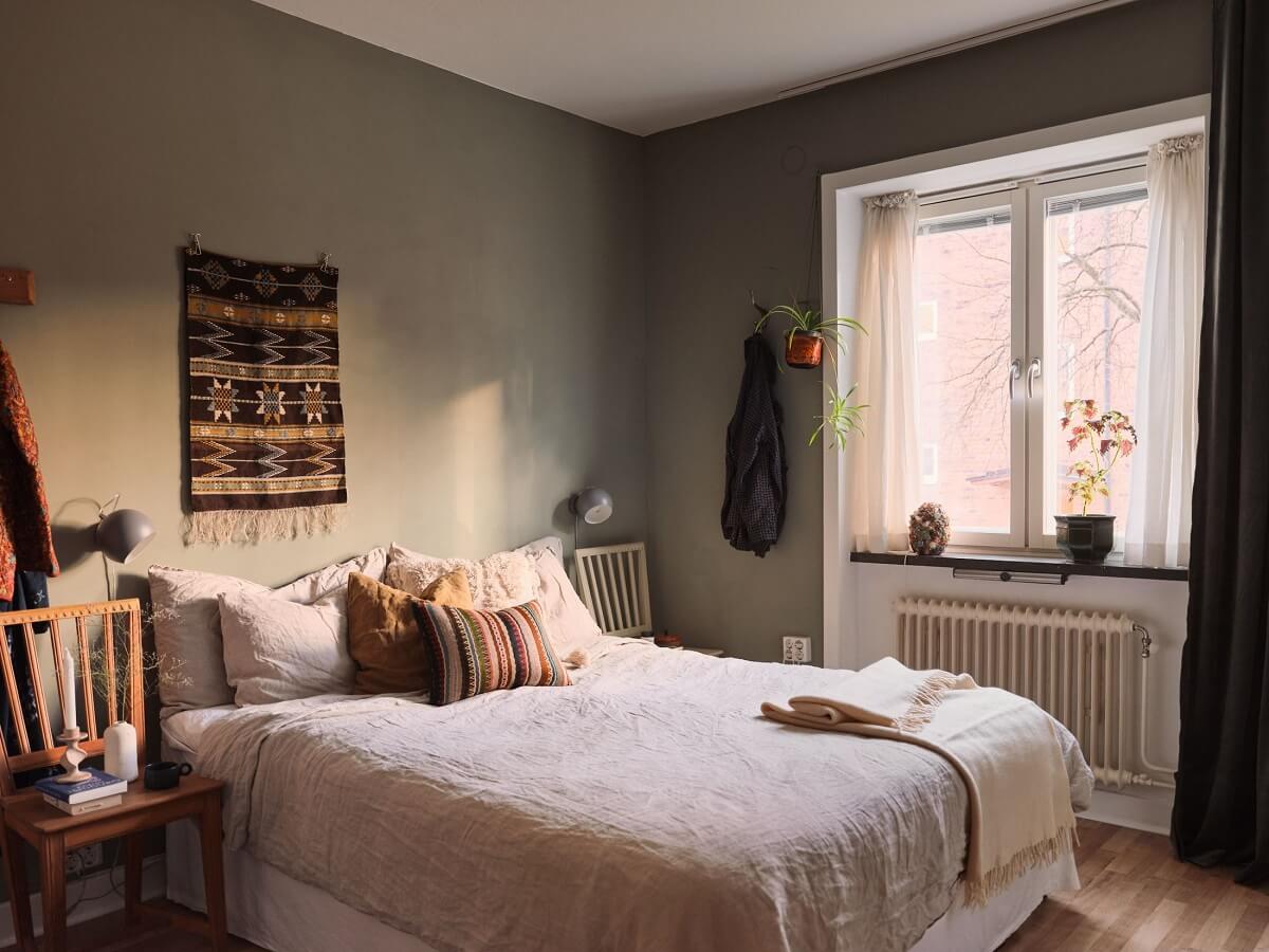 A Small Apartment with a Cozy Dining Nook 13 scandi bedroom with warm color accents