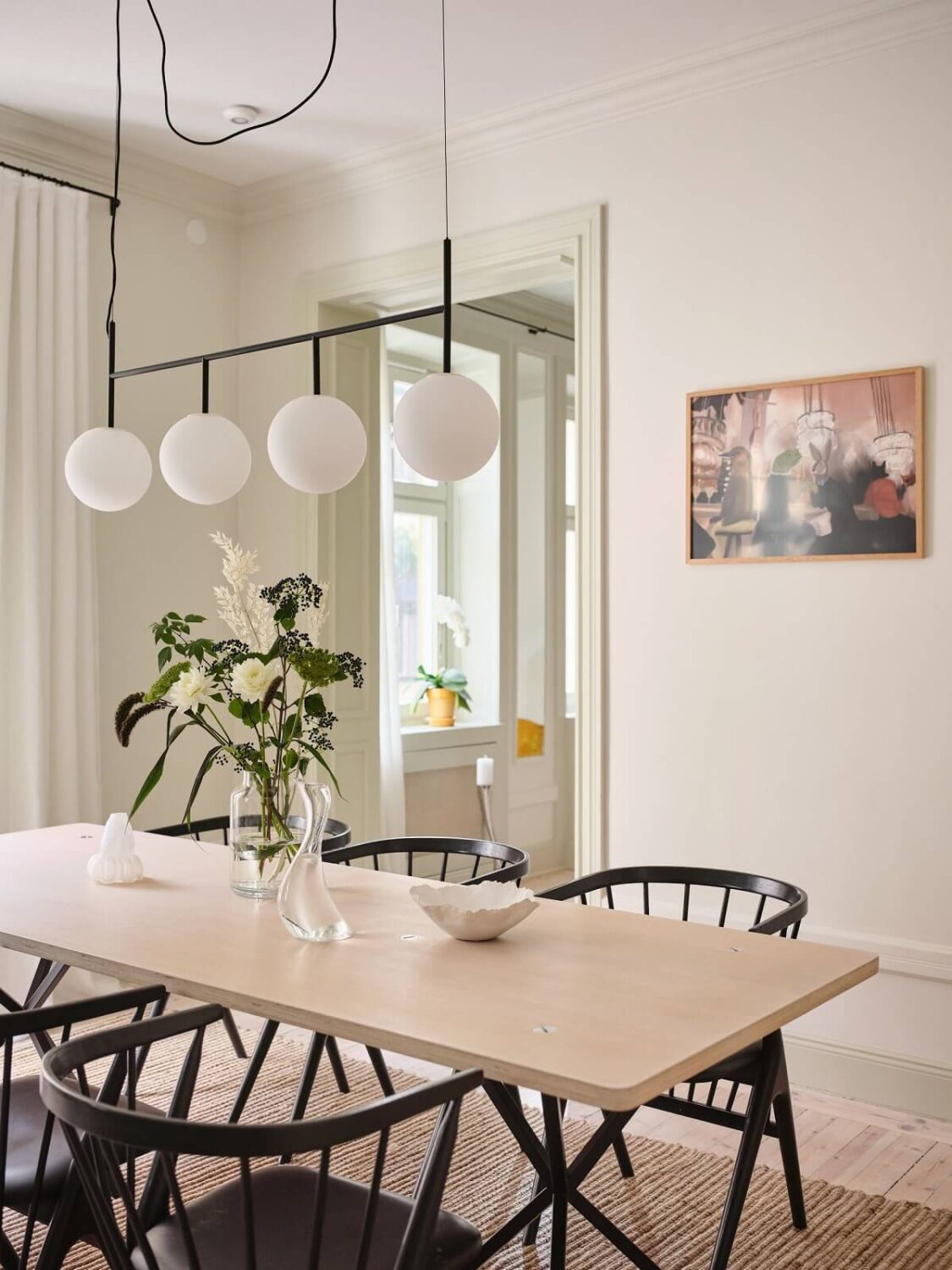 A Light Filled Duplex Apartment in Sweden 8 scandi dining table with black chairs