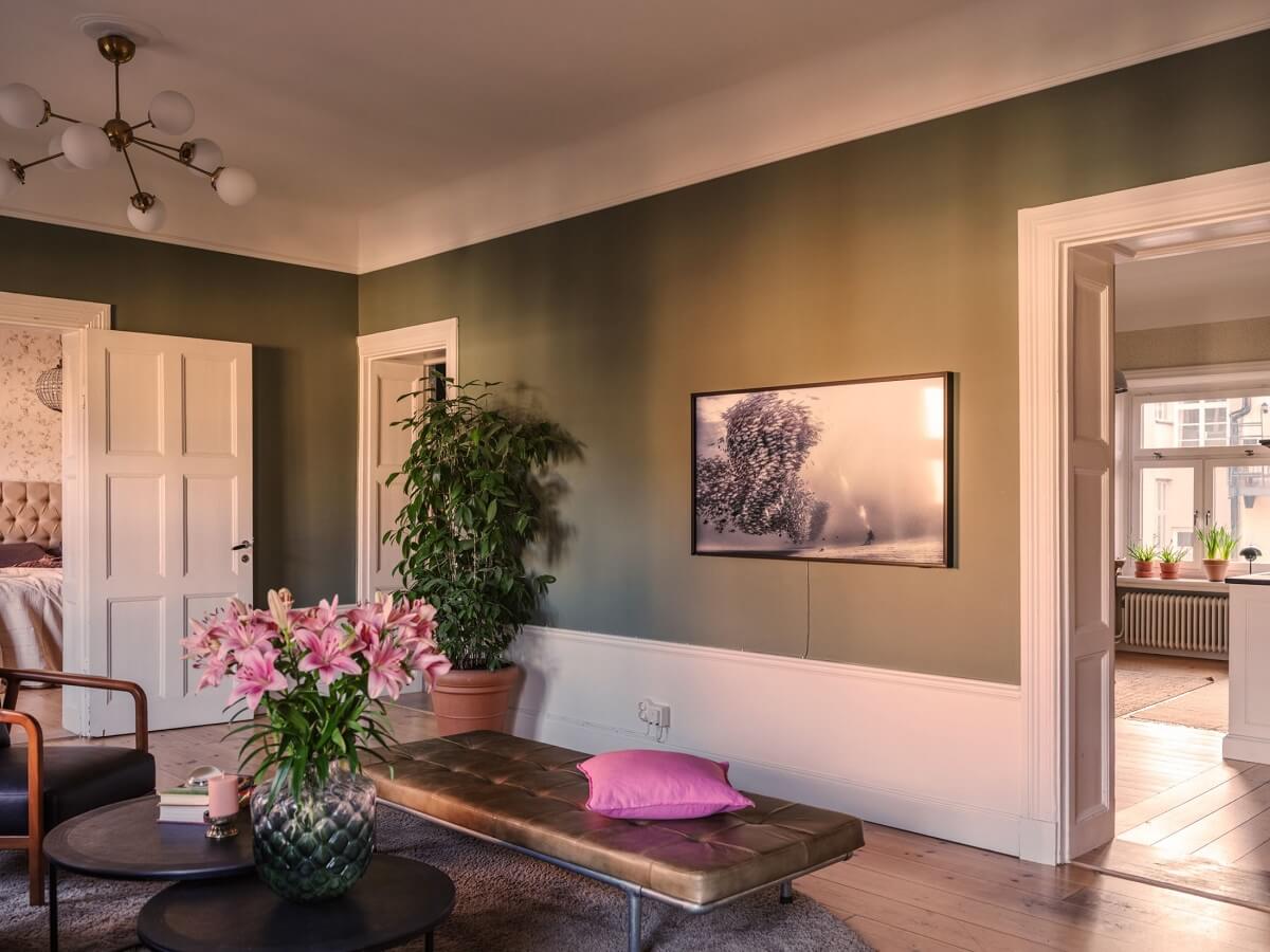 A Classic Swedish Apartment Decorated in Green and Pink Tones 8 scandi living room with green walls