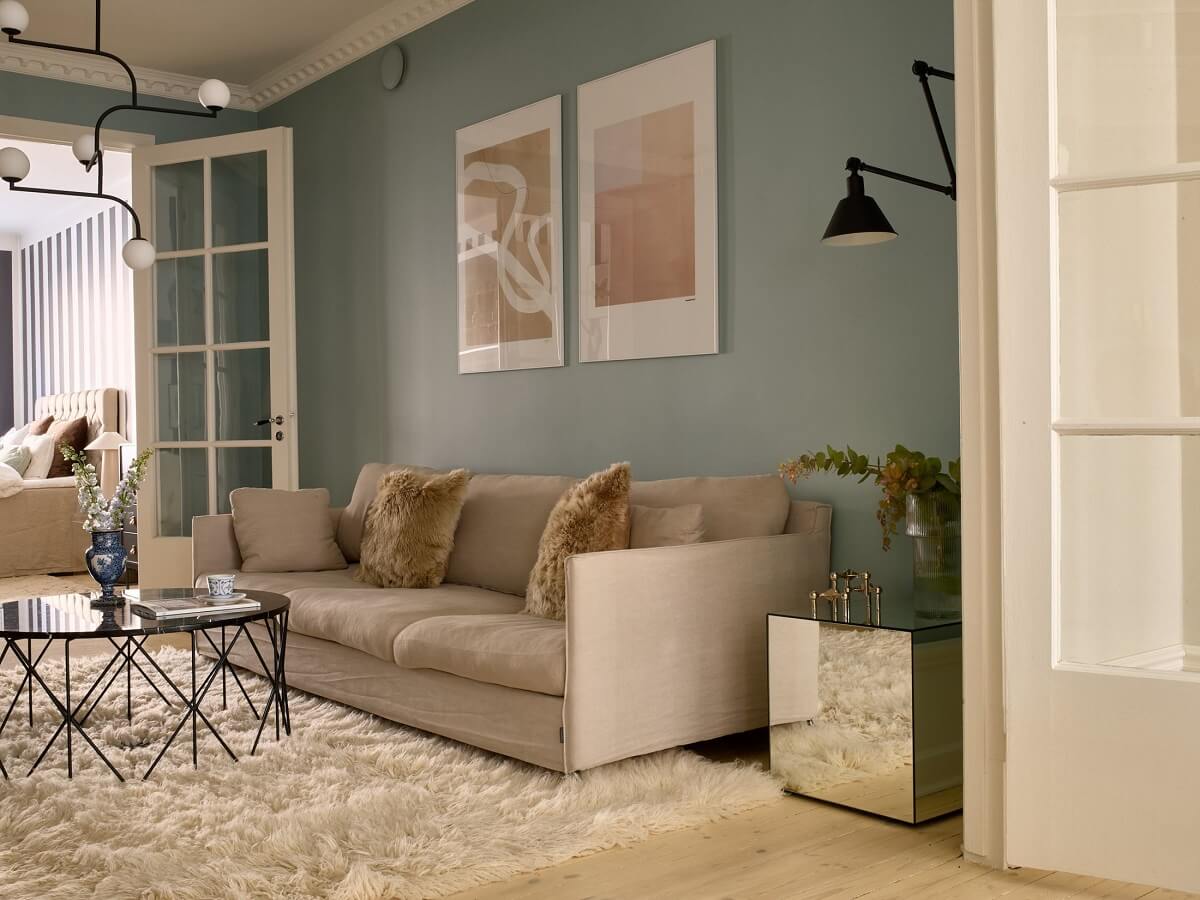 A Social Scandinavian Apartment with a Light Blue Living Room 10 scandi living room with large rug and blue walls