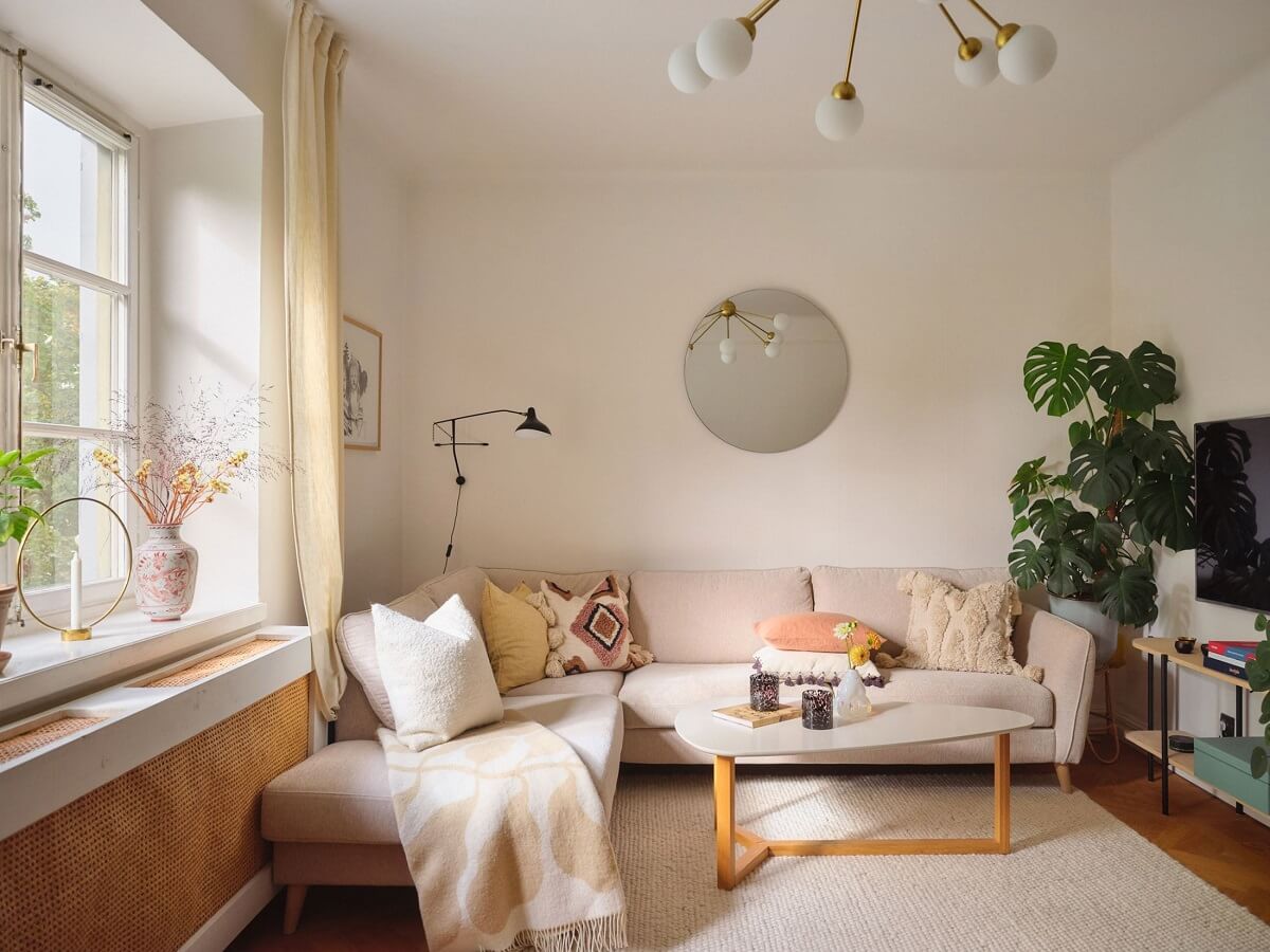 A Light Corner Apartment with a Pink Bedroom 3 scandi living room with yellow curtains