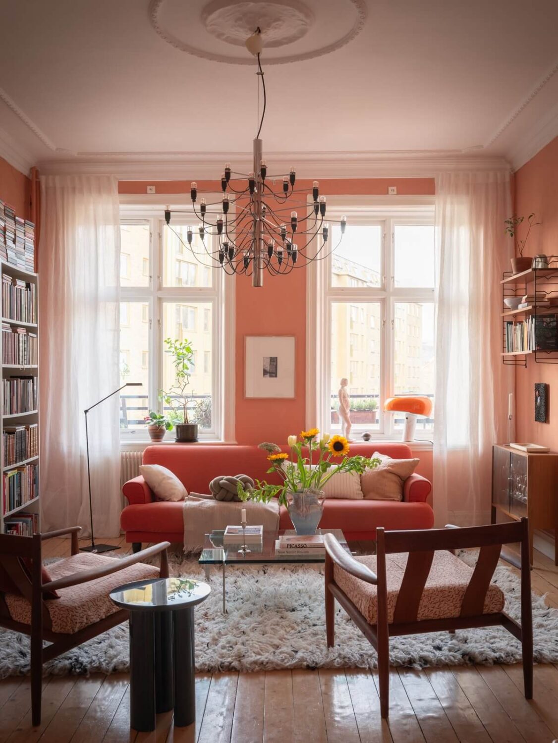 A Scandinavian Apartment with a Warm Living Room and Rounded Walls 3 scandinavian living room with arizona sunset wall paint nordroom
