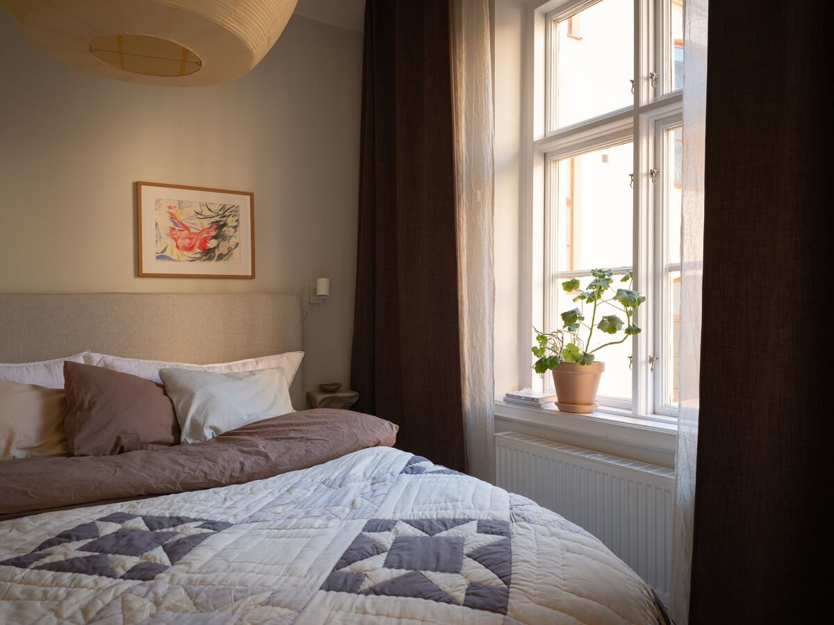 Light Rooms and Soft Color Tones in a Swedish Apartment 17 serene bedroom with dark curtains