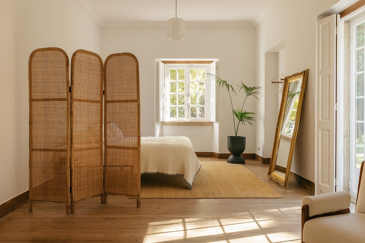 A Renovated Pink Manor House in Portugal 9 serene bedroom with rattan screen
