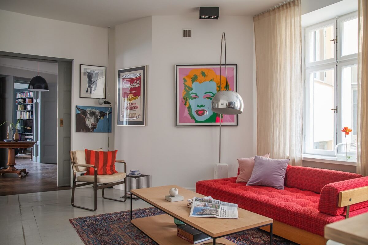 Moody Rooms in a Grand Stockholm Apartment 15 sitting room with red sofa