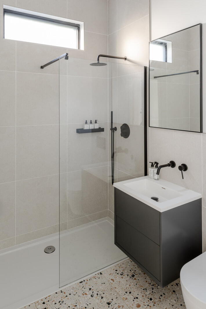 A Scandinavian-Inspired Cabin in the Woods 10 small bathroom terrazzo floor tiles