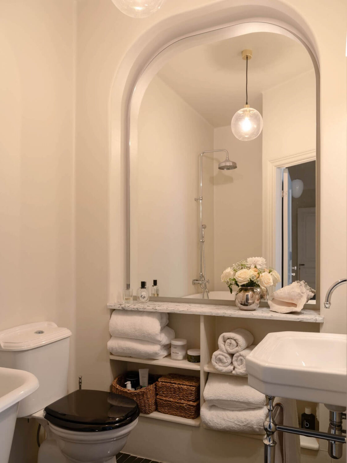 Elsa Billgren's Serene Stockholm Apartment is For Sale 23 small bathroom with mirror and built in storage