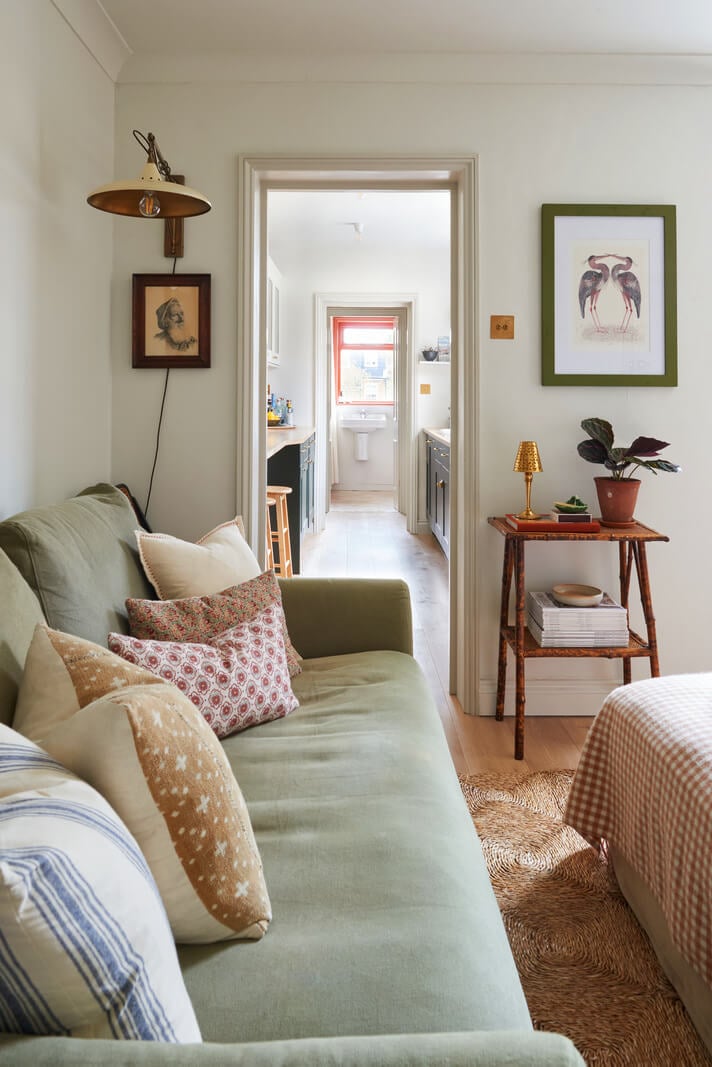 Best of 2024: Living Rooms 11 small cottage style living room with green sofa and jute rug