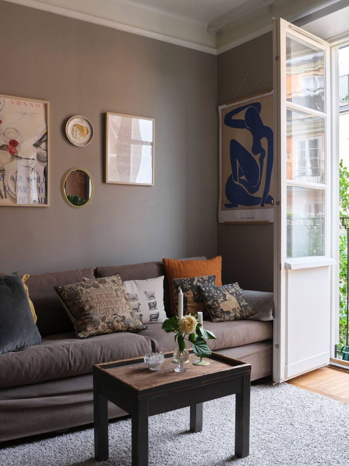 A Small Gray Apartment with Industrial Glass Walls 3 small gray living room with balcony