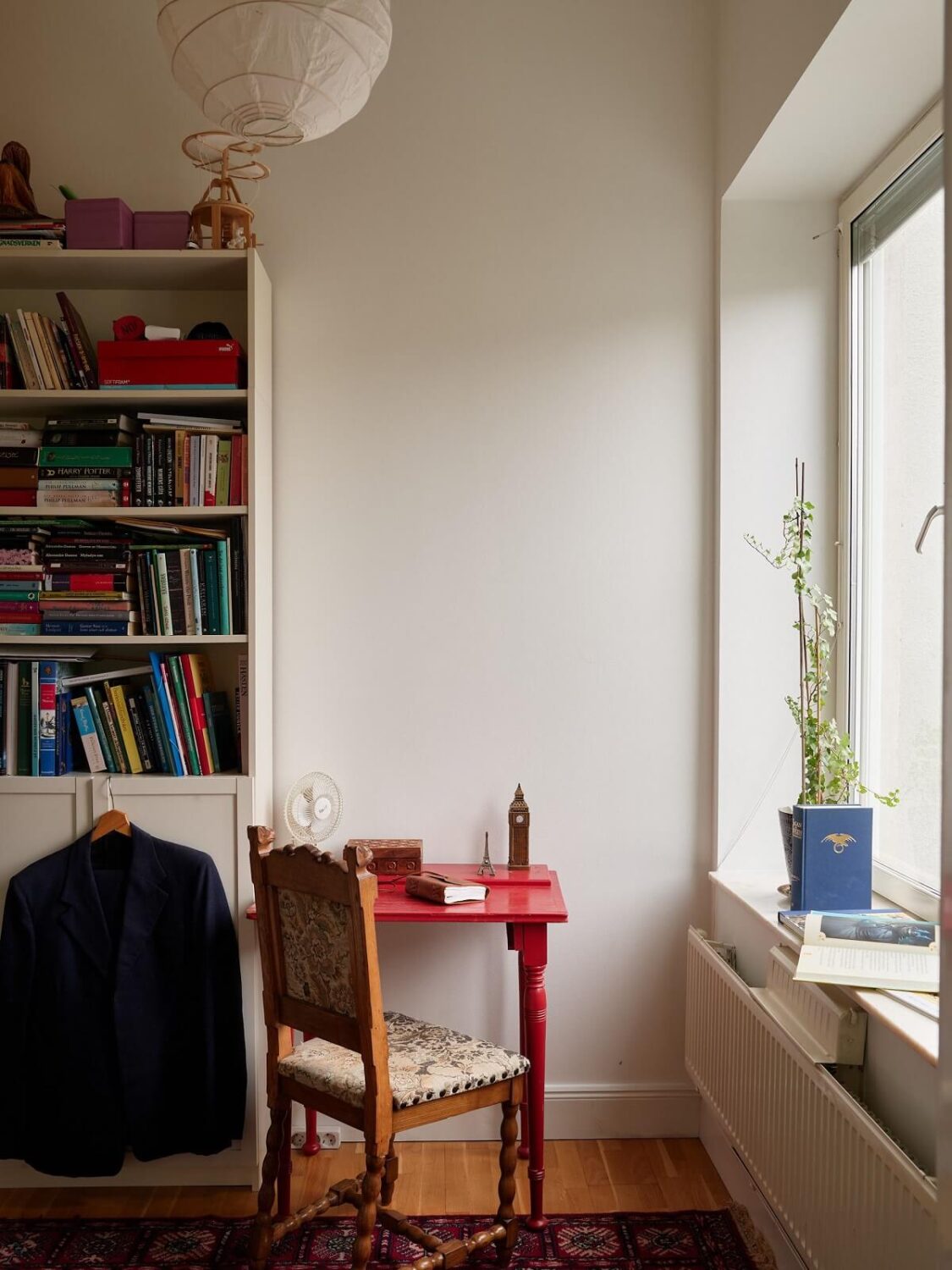 Floor-to-Ceiling Bookcases in a 1950s Swedish Home 16 small-red-desk.
