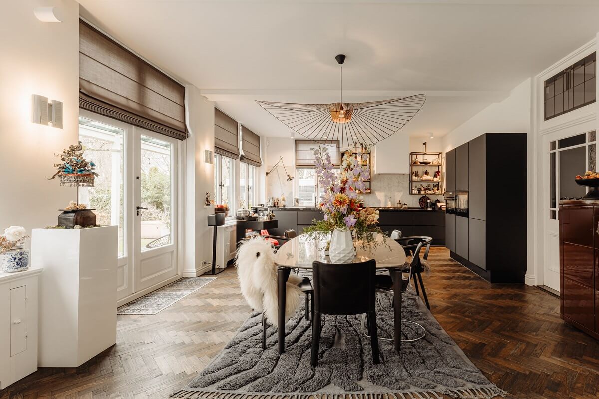 A Beautifully Renovated Dike House in The Netherlands 12 spacious kitchen and dining room with dark wooden floor