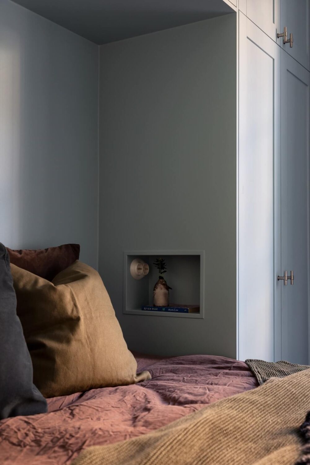 A Renovated Swedish Apartment with a Pink Bathroom 13 storage nightstand niche in wardrobes bedroom