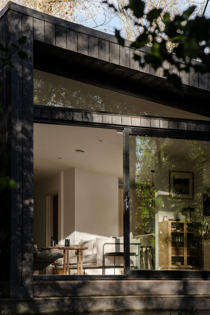 A Scandinavian-Inspired Cabin in the Woods 15 sunlight black cabin