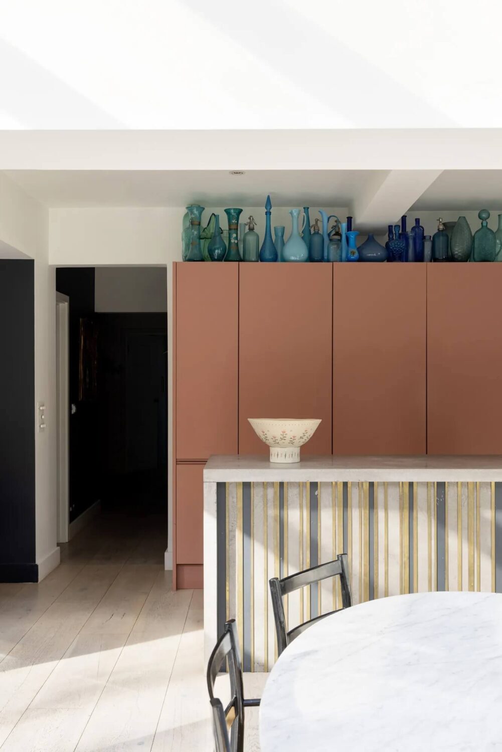 A Modern Apartment with Skylights in a Historic Building 3 terracotta colored kitchen cabinets
