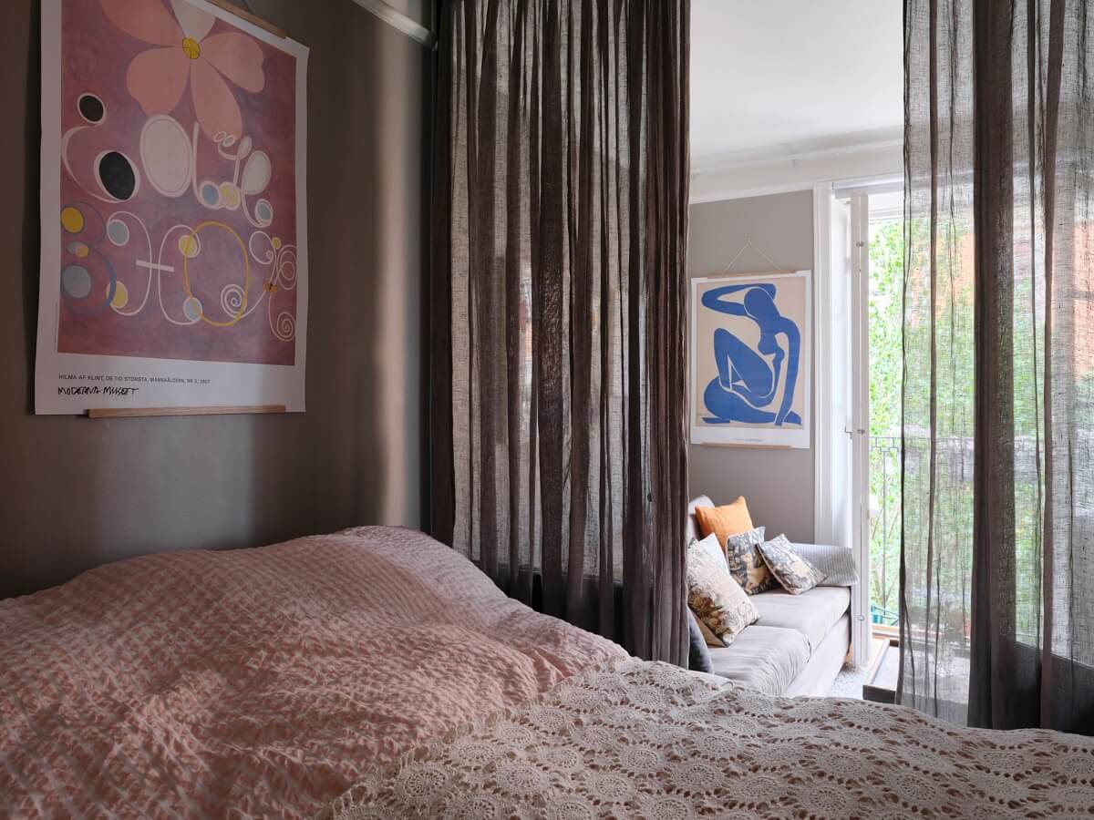 A Small Gray Apartment with Industrial Glass Walls 19 tiny bedroom with glass walls with sheer curtains