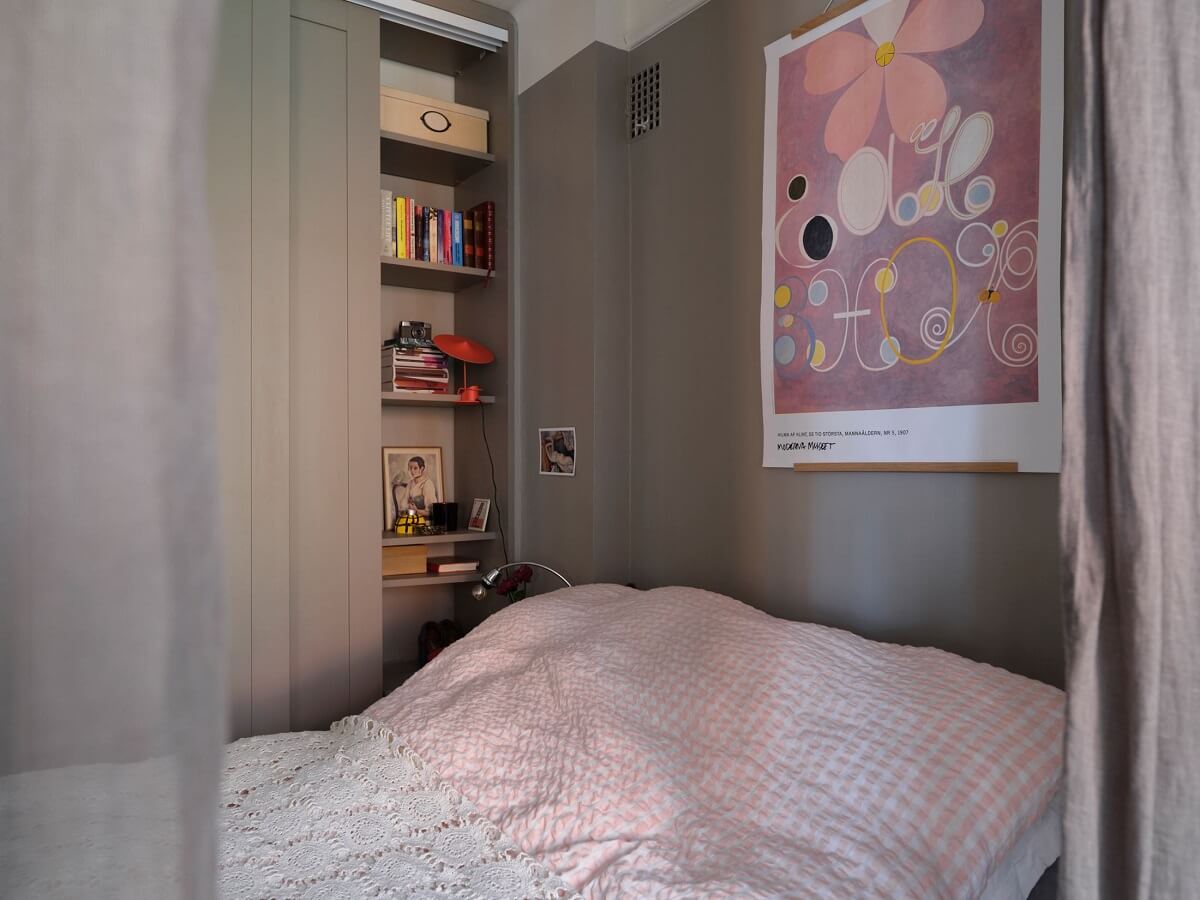 A Small Gray Apartment with Industrial Glass Walls 18 tiny bedroom with gray walls and built in shelves