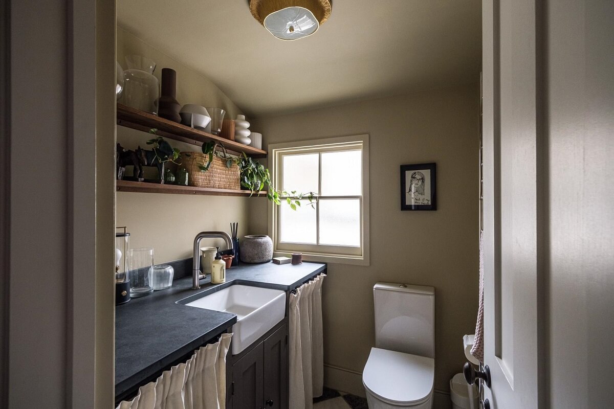 A London House Decorated in Gray and Beige Tones 13 utility room with toilet