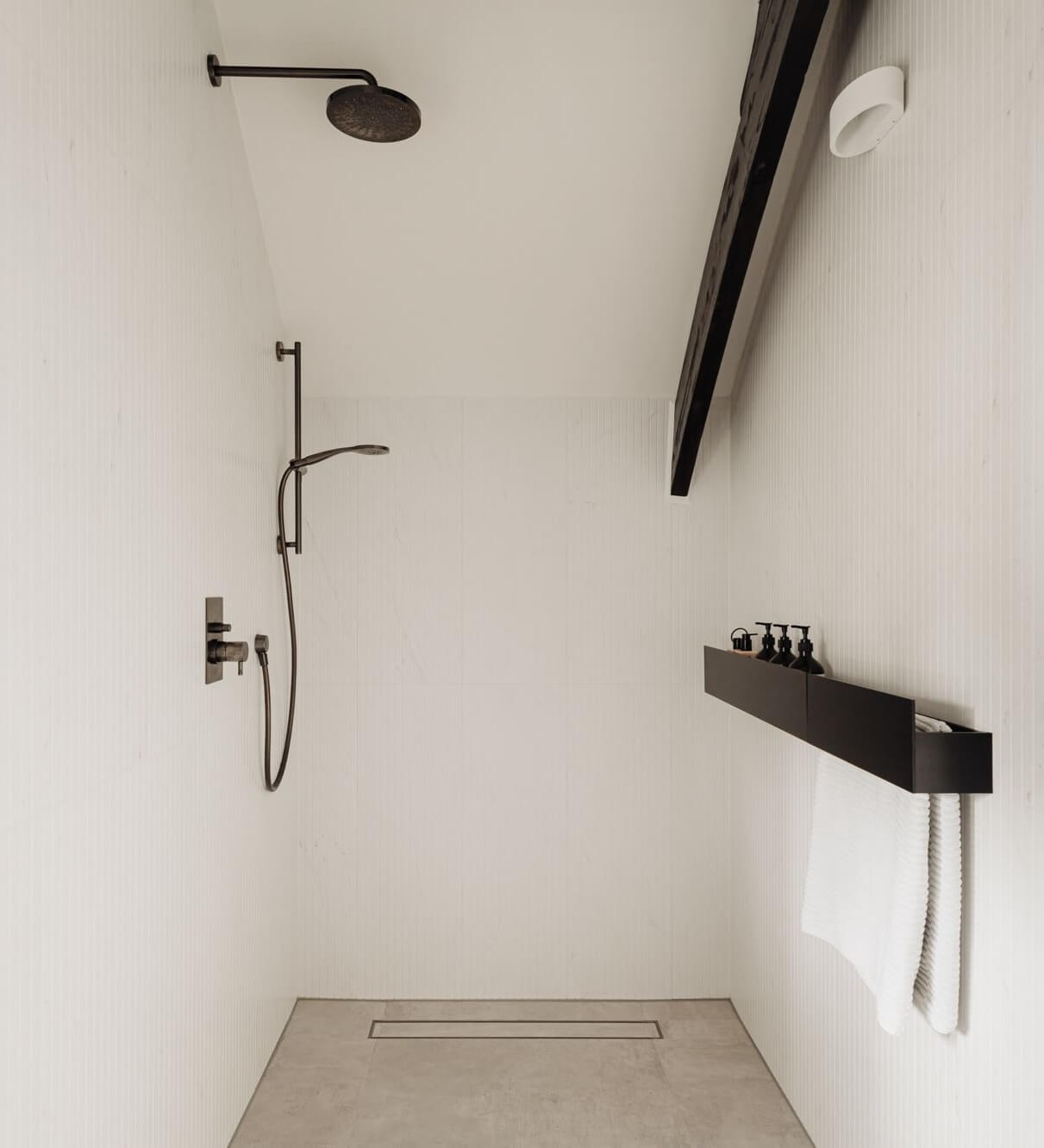 A Beautifully Renovated Dike House in The Netherlands 23 walk in shower with black fittings