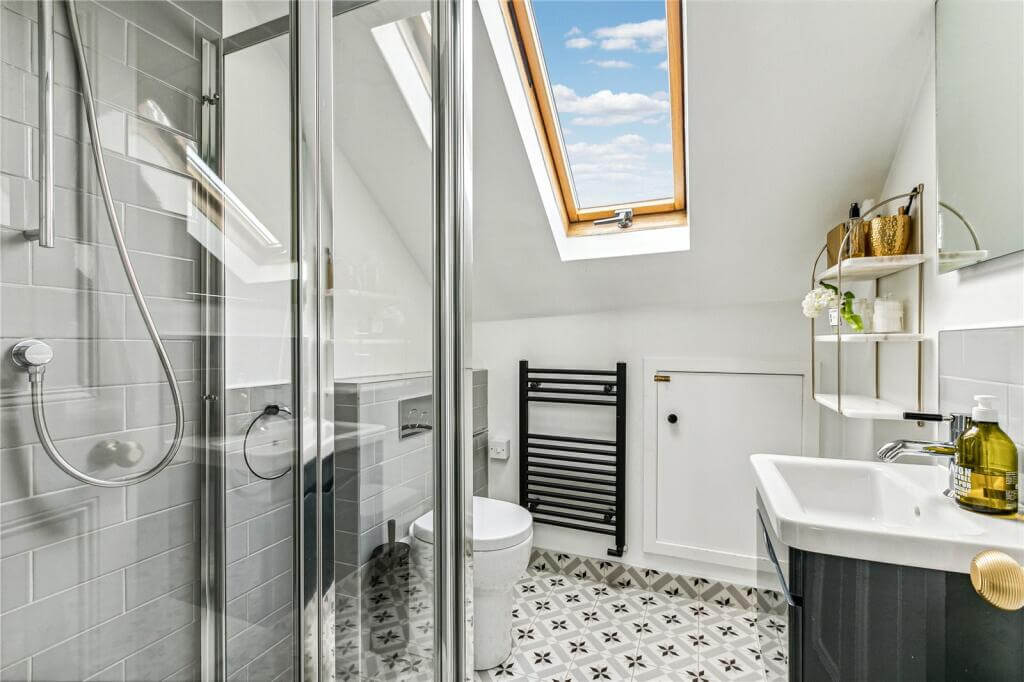 An Extended Victorian House Decorated in Gray Tones 15 white attic bedroom
