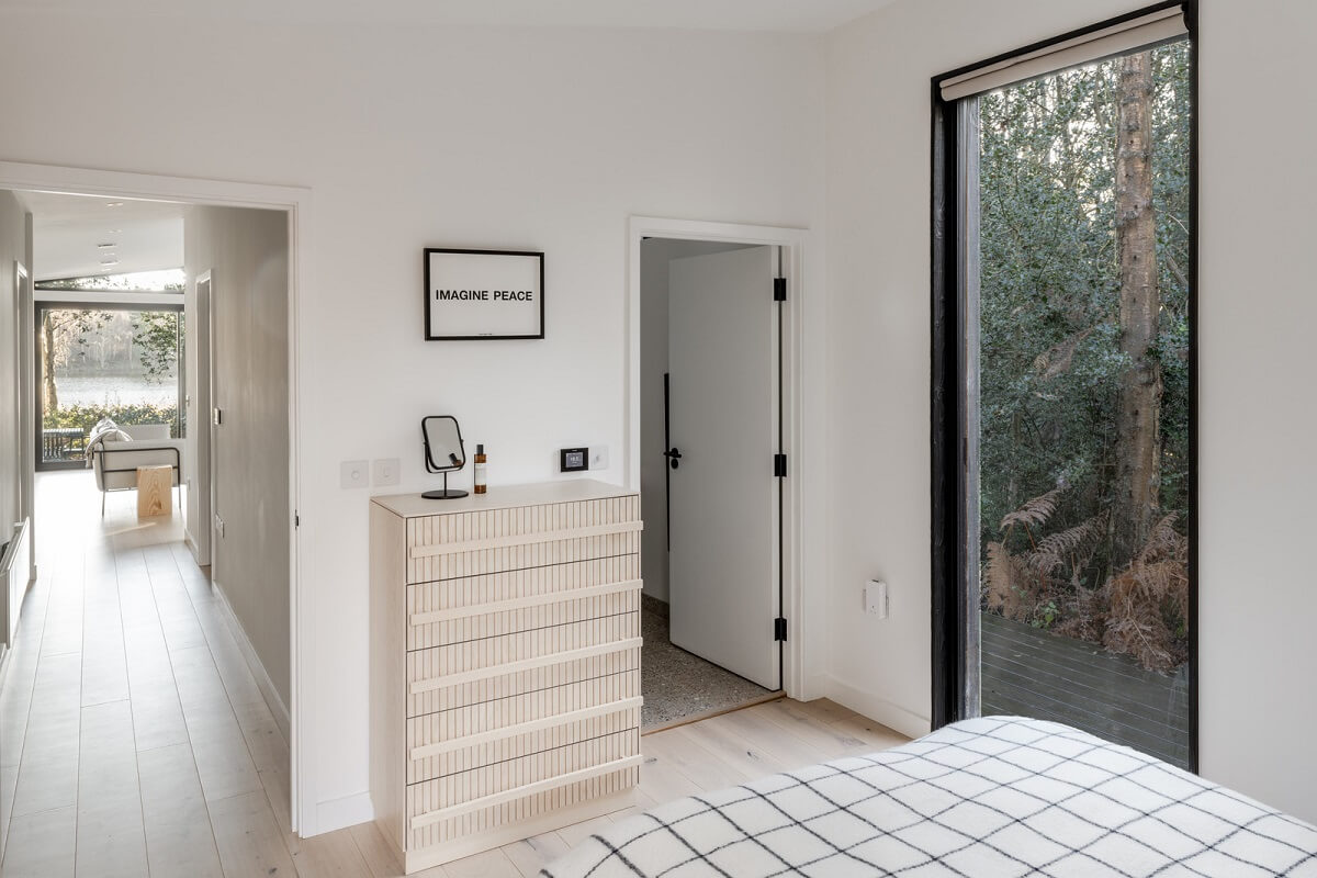 A Scandinavian-Inspired Cabin in the Woods 12 white bedroom cabin