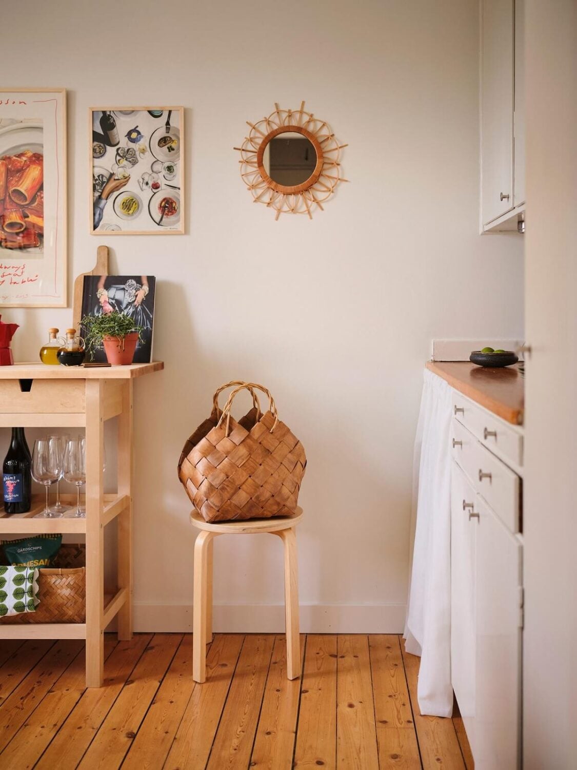 A Small Midcentury Apartment in Stockholm 6 white kitchen with wooden floor