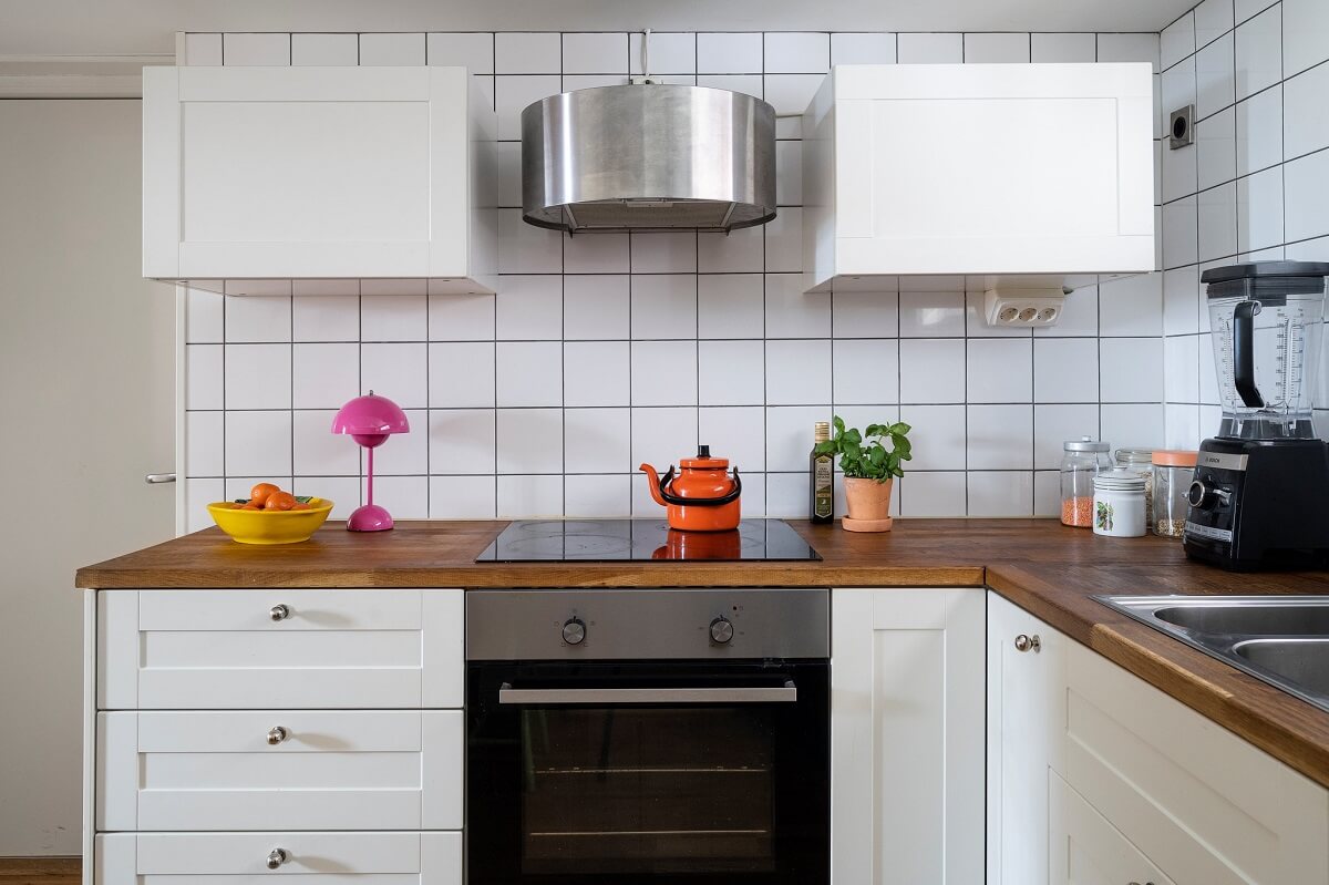 A Basement Family Apartment with Colorful Furniture and Decor 10 white kitchen