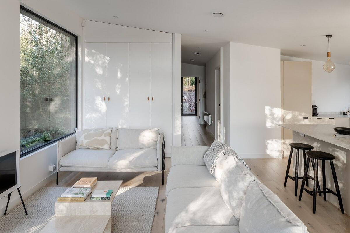 A Scandinavian-Inspired Cabin in the Woods 6 white open plan living room cabin