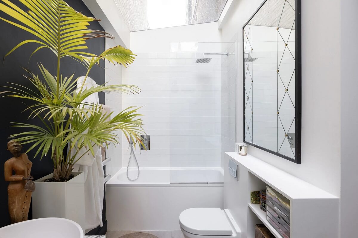 A Modern Apartment with Skylights in a Historic Building 14 whte bathroom with dark gray accent wall