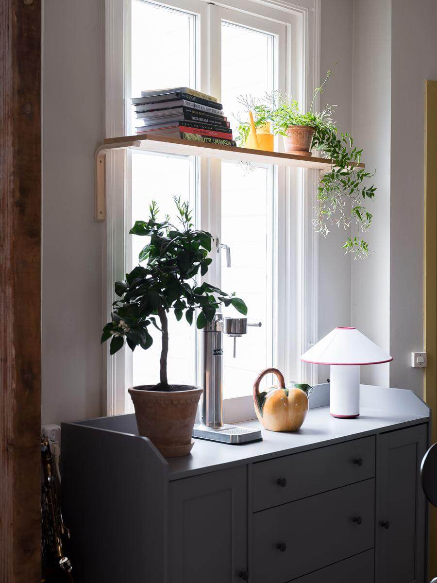 A Beautiful Color Palette in a Scandinavian Family Apartment 11 window shelf