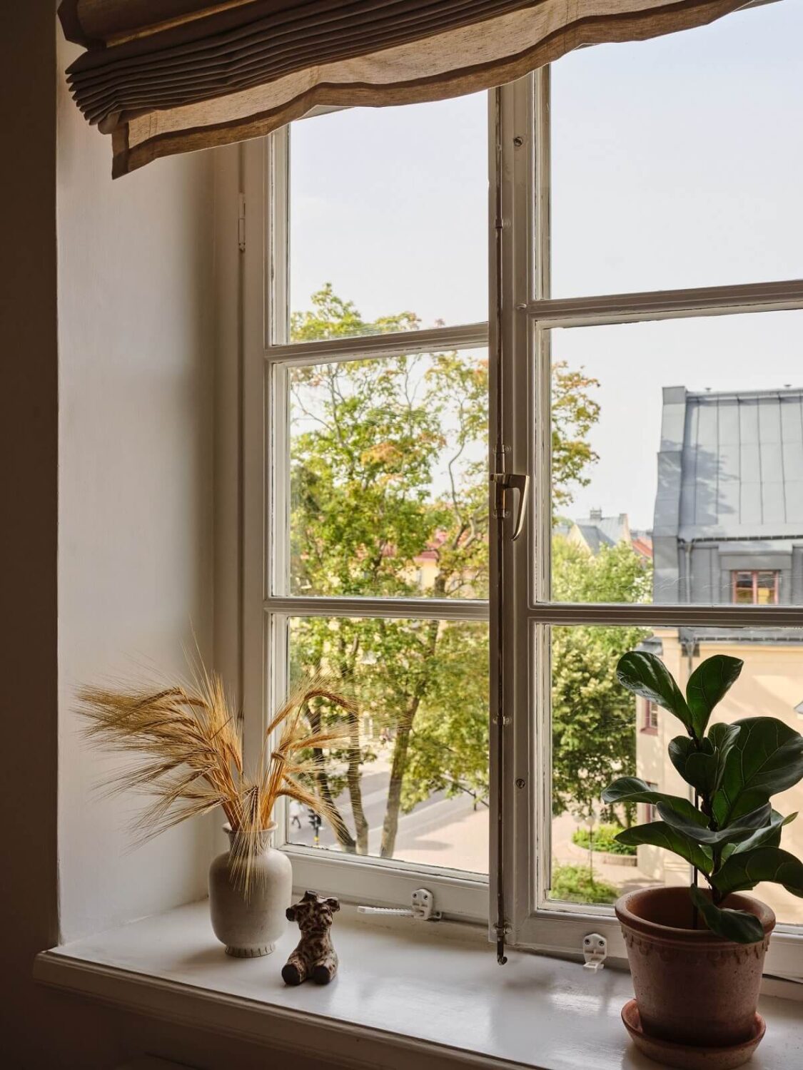 A Light Corner Apartment with a Pink Bedroom 15 window view