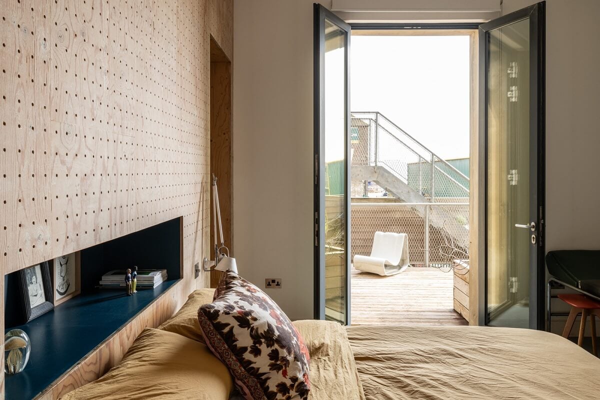 An Industrial English Loft with Yellow Color Pops 13 wooden accent wall and blue niche bedroom