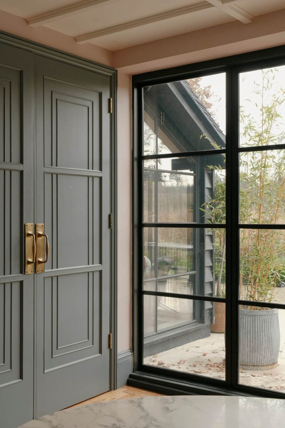 A Barn House with Vintage Decor and Exposed Beams 14 wooden doors and industrial glass windows