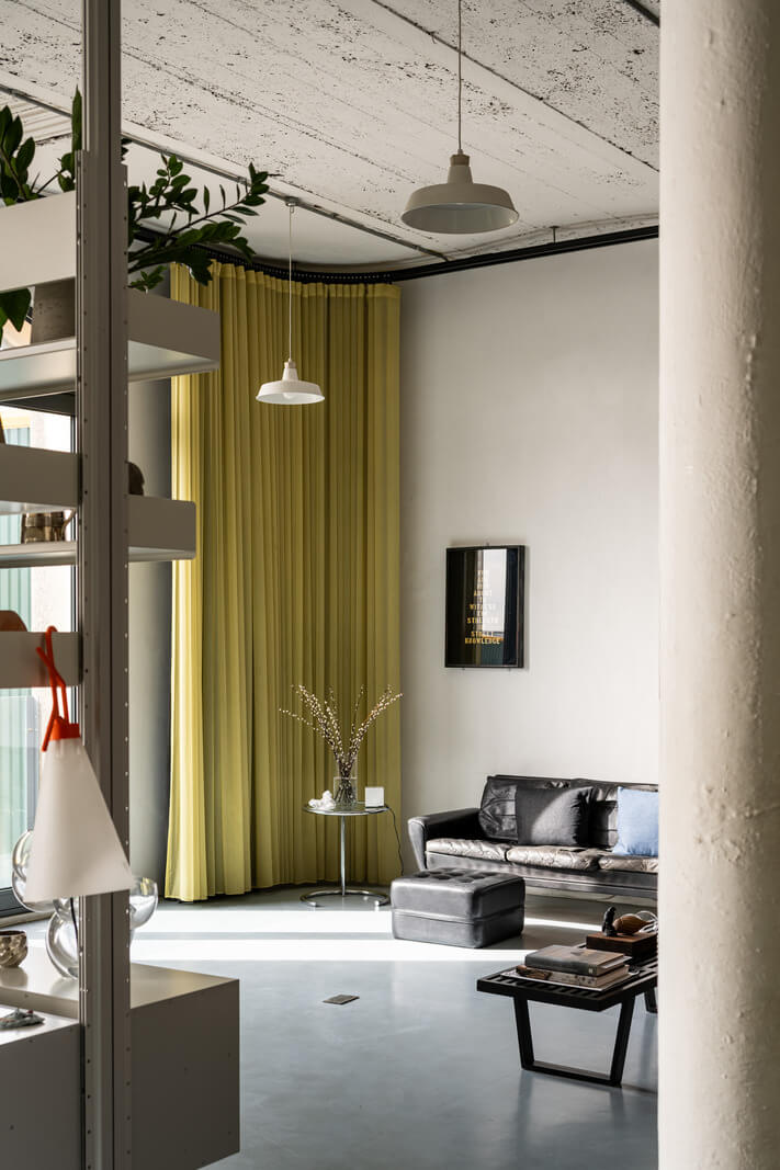 An Industrial English Loft with Yellow Color Pops 2 yellow curtains