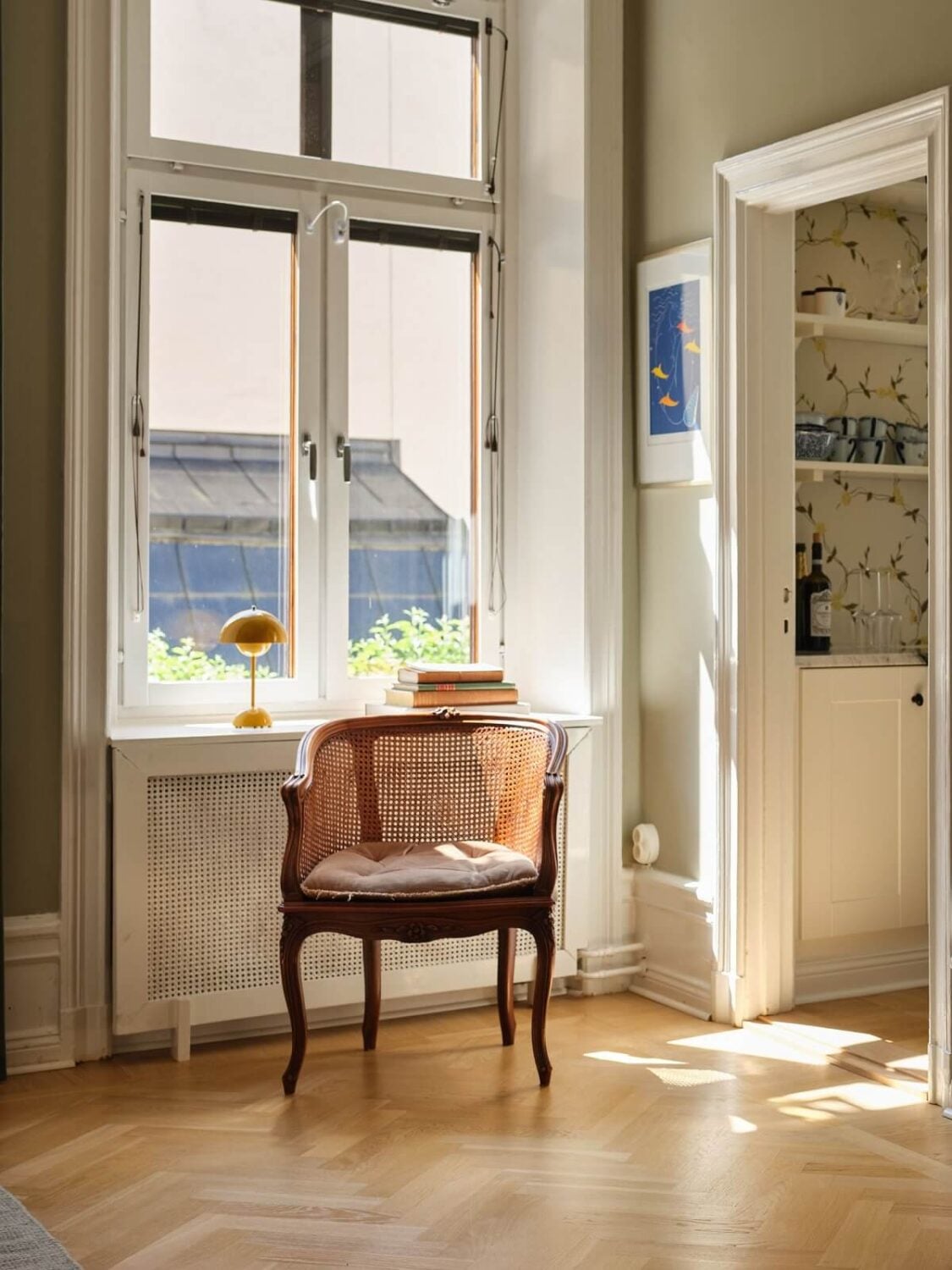 A Classic Stockholm Apartment with Floral Wallpaper 22 antique chair in bedroom