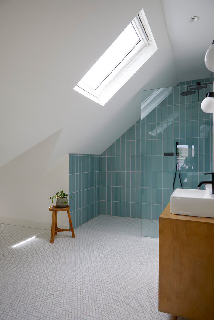 A Colorful London Family Home Renovated by Fraher & Finlay 32 attic bathroom with blue walk in shower
